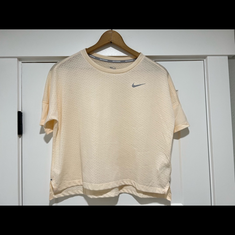 Nike dry-fit running shirt. Never been worn, tags removed.